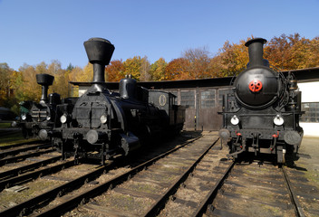 Fototapeta na wymiar Old Vintage Steam Locomotive At The Train Depot 