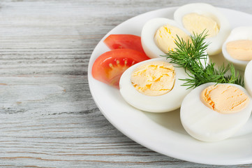 Boiled hen eggs and tomato