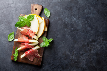 Fresh melon with prosciutto and basil