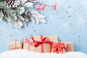 Christmas background with gifts in snow