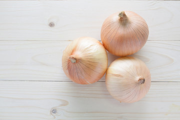fresh onion on wood table