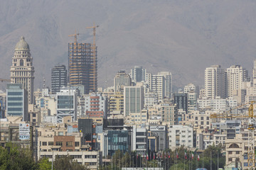 Tehran skyline and greenery in front of Alborz Mountains