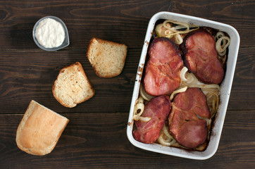 baked smoked pork neck with onion, toasts and horseradish dip
