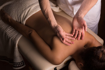 Fototapeta na wymiar Relaxing massage at spa studio