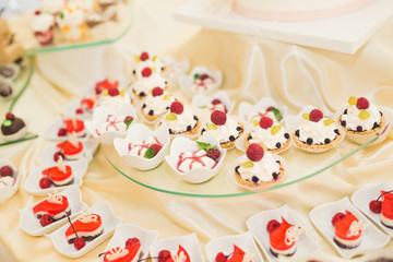 Fototapeta na wymiar Delicious wedding reception candy bar dessert table