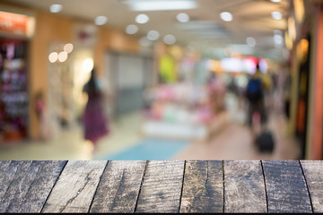 Wood desk and shopping mall,vintage tone.