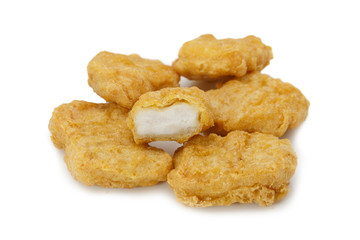 Fried chicken nuggets bites isolated on white background
