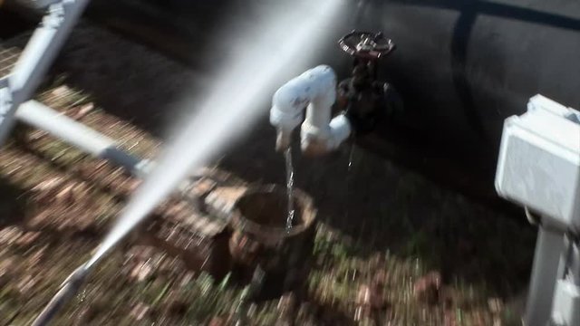 Professional is cleaning a pipeline with a jet cleaner