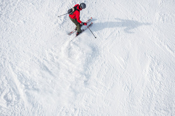 A skier on a ski slope.