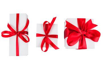 white gift boxes with red ribon on white background