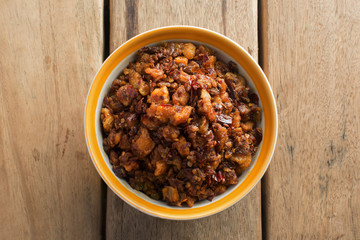 chilli pork dip fried on wooden table, food of thailand.