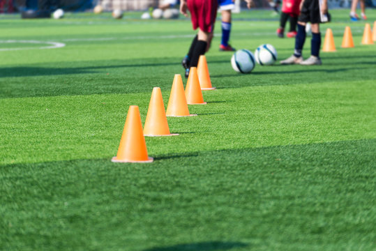 blurred image of Coach is coaching Children Training In Soccer T
