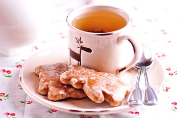 Cup of green tea with honey biscuits