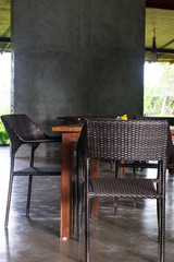 dining set with wood table and rattan chairs