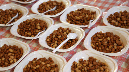 dishes filled with boiled beans during the village feast