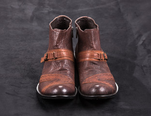 men's leather vintage shoes isolated on a black background