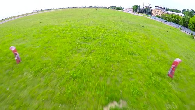 Skydiver is landing on a parachute, pov