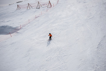 Little skier on a ski slope.