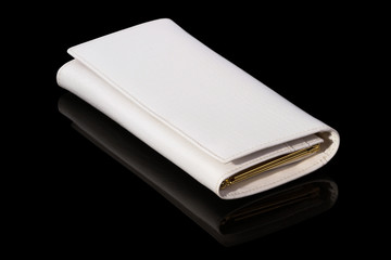 White purse on a black background