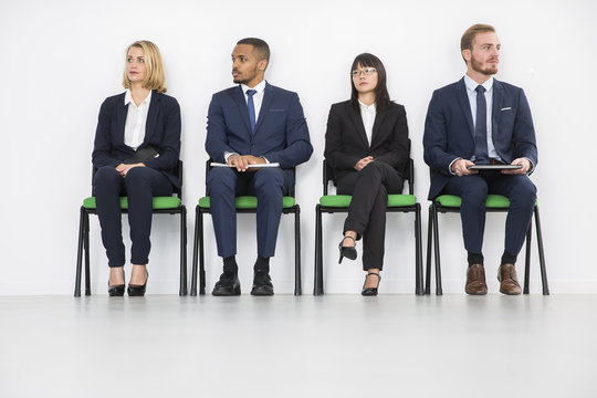 Stressed business people waiting for job interview