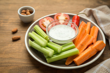 Vegetarian healthy snacks, vegetable snack: carrots, celery, tom