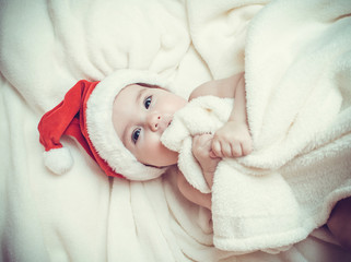 Little child in x-mas cap. Happy 2017 Year!