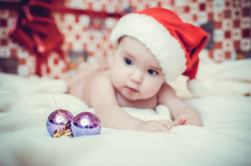 Little child in x-mas cap. Happy 2017 Year!