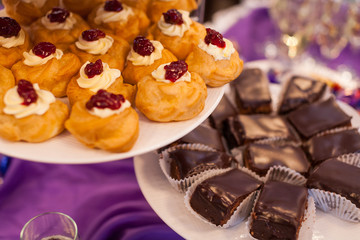 fourchette, custard cakes, Sweet holiday buffet with cupcakes and other desserts, cathering in the restaurant, chocolate cakes