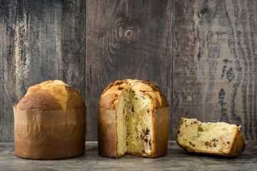 Christmas cake panettone on a rustic wooden background

