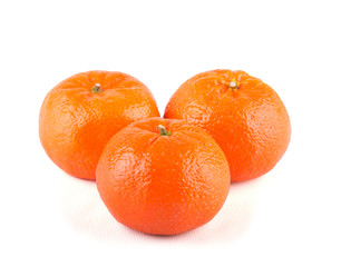 Three Clementines on white