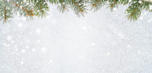 christmas card or new year background made of glittering snowflakes with fir-tree branches