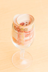 Russian money in denominations of five thousand rubles rolled in