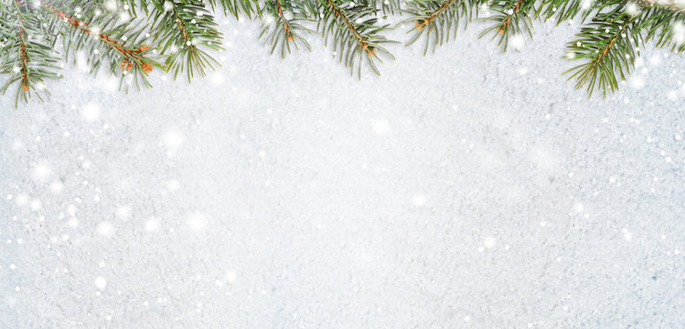 christmas card or new year background made of glittering snowflakes with fir-tree branches