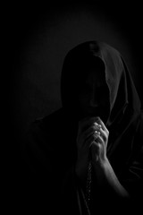 Catholic monk with a rosary