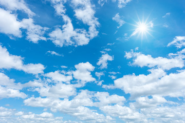 Fototapeta na wymiar Blue sky with clouds and sun reflection