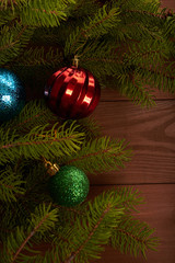 Christmas tree and decorations on wooden background