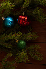 Christmas tree and decorations on wooden background