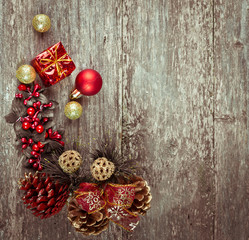 Christmas decoration on abstract background,vintage filter. Instagram colors toning. Xmas card and gift. Winter holidays theme. Top view. Empty space for text.