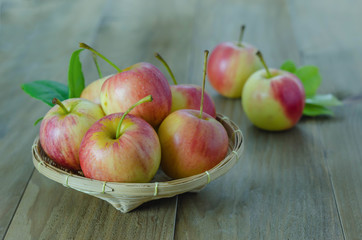 Red and yellow apple   on wooden background