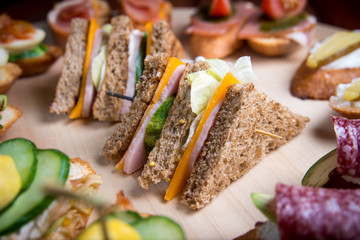 Bruschetta crostini set on a wooden tray. The concept of the Italian cuisine.