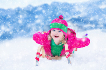 Little girl having fun at sleigh ride