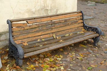 Wooden bench against the wall.
