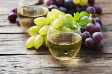 White grapes juice on the wooden table