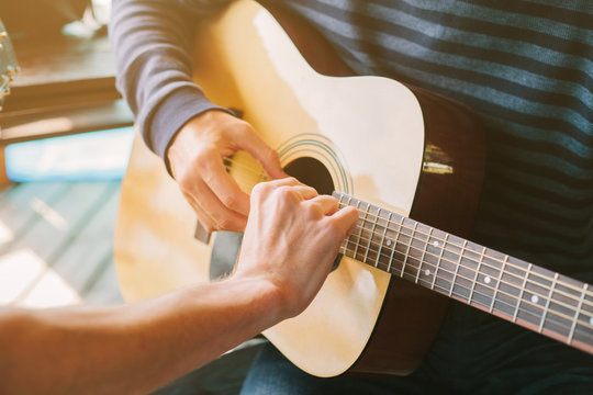 Learning to play the guitar. Music education and extra-curricular lessons.