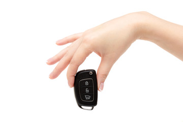 Female hand holds car keys.