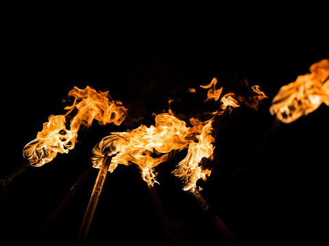 Flaming torches at night