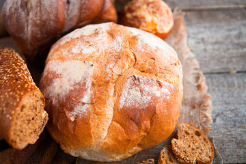 Close-up of traditional fresh bread on rustic table