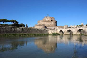 Fototapeta na wymiar The Mausoleum of Hadrian, usually known as the Castle of the Holy Angel (Castel Sant Angelo), and bridge over Tiber river, Rome, Italy