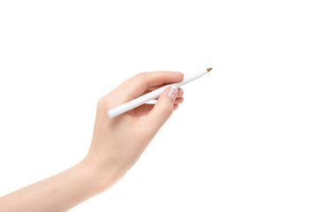 Female hand holds a pen on a white background.