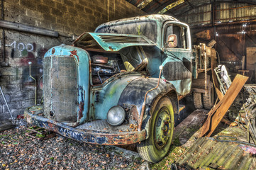 Abandoned old truck in a garage - 125636561
